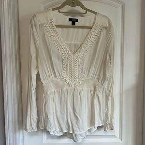 Cream colored long sleeve rayon blouse. Size L.